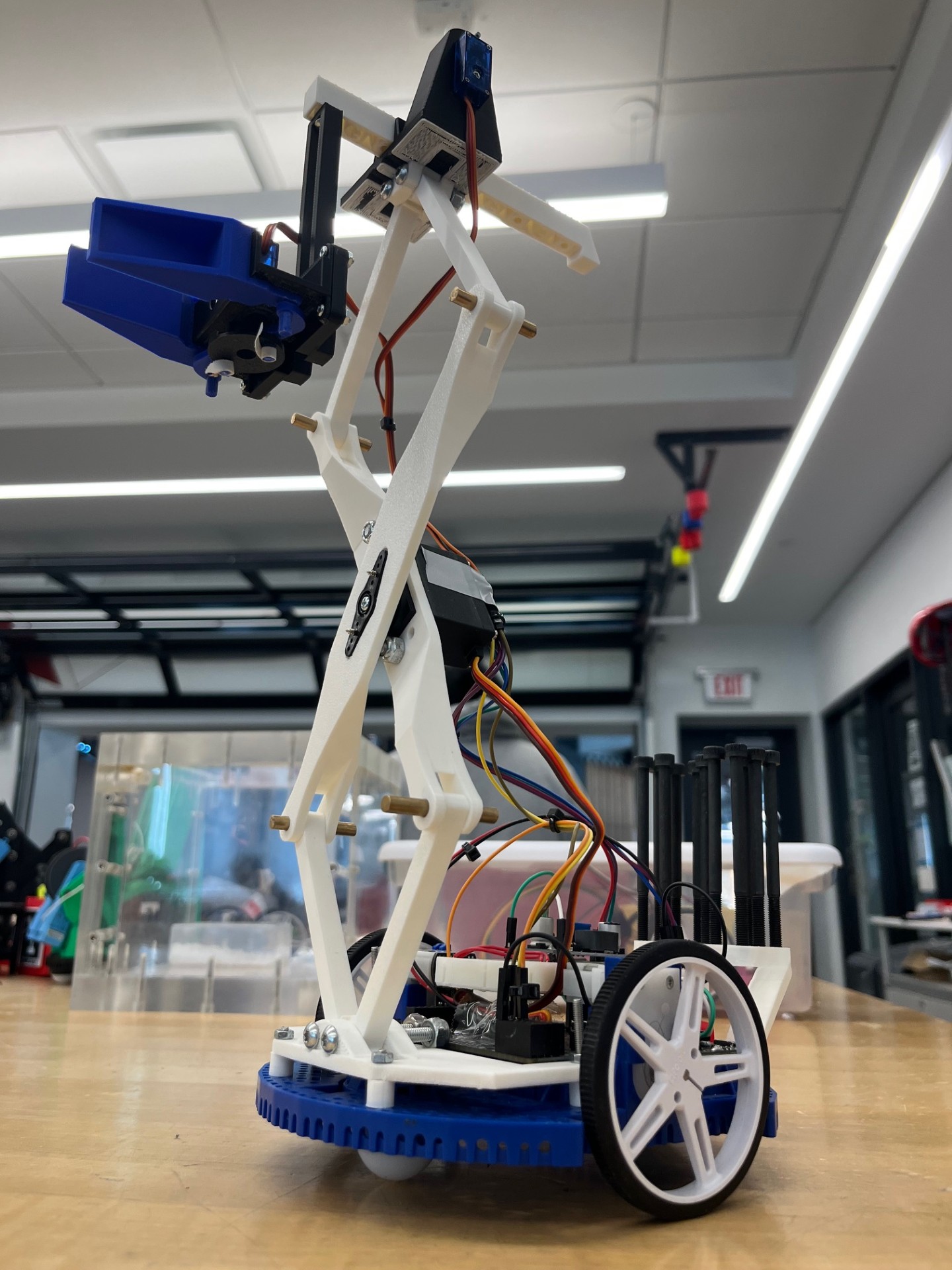 Package Transport Romi robot with scissor lift and gripper